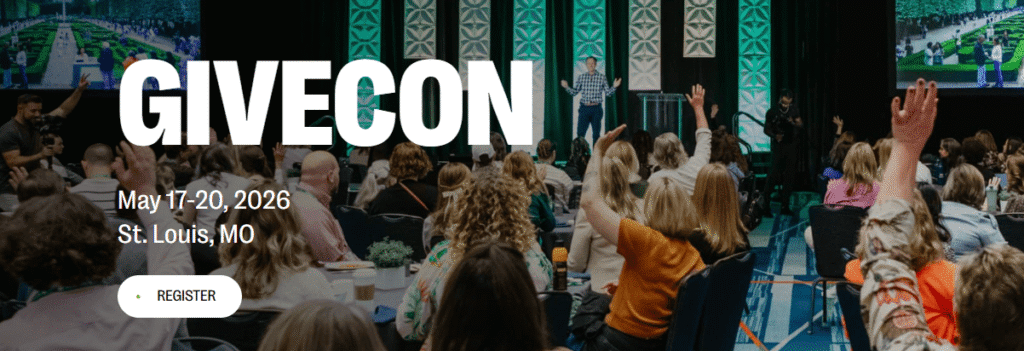 Large audience raising hands during a session at GiveCon 2026 in St. Louis, a top nonprofit conference by Bloomerang focused on donor retention, happening May 17-20.